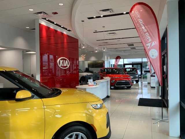 Yellow Kia in Showroom