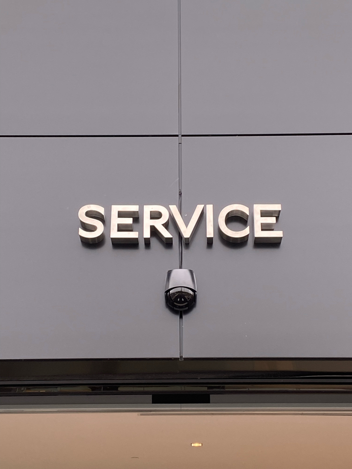 The S on the service sign over the entrance to the service department is upside down. The Devil is in the details