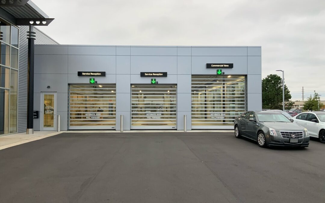 Three Rytec Full Vision spiral doors on the front of a dealership's service drive