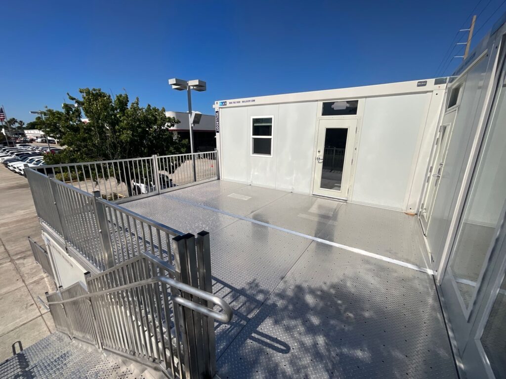 A small deck area on the second floor provides a place for staff to relax while having a view over the whole lot.