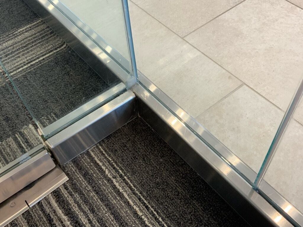 Overuse of caulk for miss measured interior glass results in poor looking installations. Caulking has quietly replaced craftsmanship.