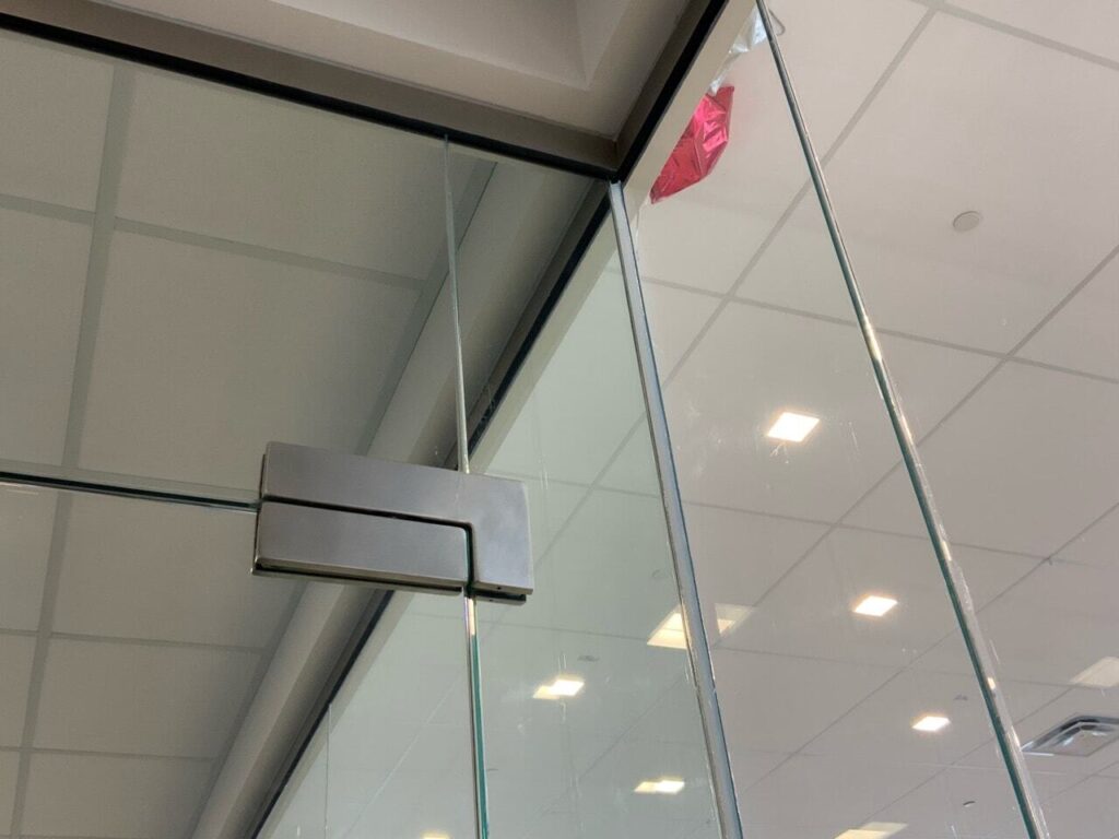 Another example of a large gap between glass panels filled with caulk.